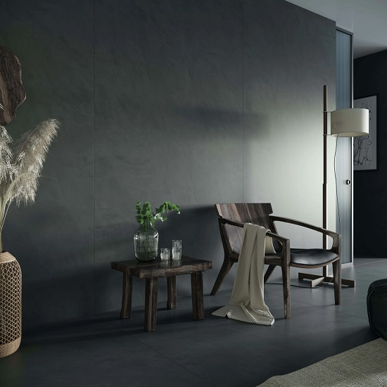 a black living room with Dekton Micron walls and floors
