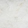 Textura detallada de superficie Dekton Evok en gris ceniza con vetas suaves y movimiento controlado.
