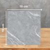 Muestra 10x10 cm de Blaker Total Boreal Grey gris con vetas blancas sobre fondo gris.