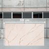 Losa grande de Ceratop Macadamia Cream 320x160 cm crema veteado en almacén industrial.