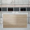 Losa grande de Blaker Flaminio Dak 320x160 cm beige veteado en almacén industrial.