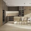 Cocina moderna con isla Blaker Flaminio Dak beige veteado, taburetes blancos y gabinetes oscuros en ambiente elegante.