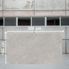 Losa grande de Venux Bourgogne Perle 320x160 cm gris uniforme en almacén industrial.
