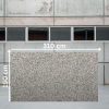 Losa jumbo de Granito Crema Julia de 310 x 190 cm con motas negras y grises