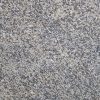 Textura detallada del Granito Mondariz, granito crema con motas negras y grises