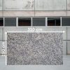 osa jumbo de Granito Mondariz de 310 x 190 cm en crema con motas negras y grises