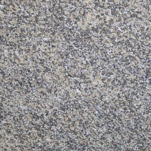 Textura detallada del Granito Mondariz, granito crema con motas negras y grises